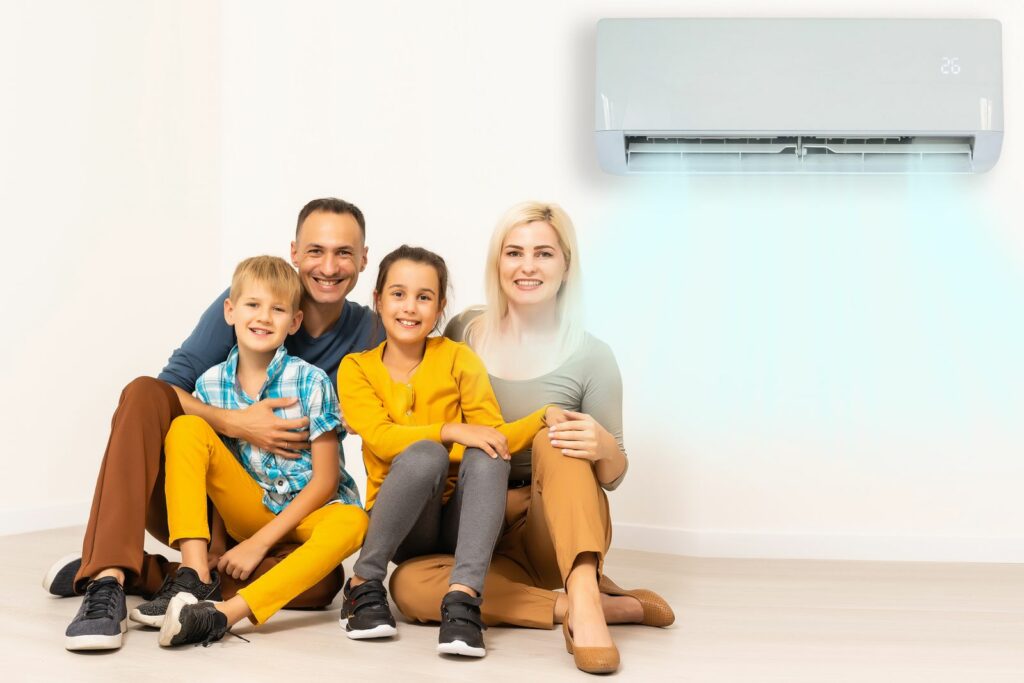 Family sitting by heat pump